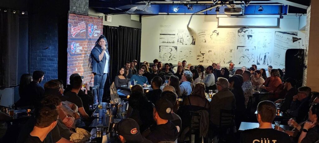 Live comedy show in Montreal with audience watching comedian at Comedyville